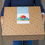 Pappschachtel von Große Grimm's Stufenpyramide mit 100 Holzbausteinen in Regenbogenfarben