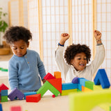 Kinder am Spielen mit Grundbaukasten 2 von Grimm's