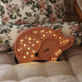 Kinderlampe Reh von Little Lights auf Sofa