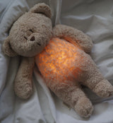 Moonie Teddybär Einschlafhilfe und Kuscheltier im Farbton Organic Sand mit leuchtendem Bauch