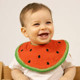 Lachendes Kind mit Lätzchen "Wally the Watermelon" von Oli&Carol