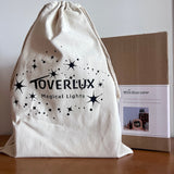 Toverlux Lampe mit Stoffbeutel und Produktverpackung