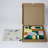 Geöffnete Verpackung von Baukasten Movement der Tiny Art Collection von Grimm's