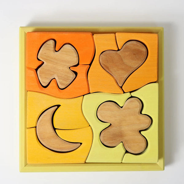 Bauspiel Gelb von Grimm's mit 12 Holzteilen im Rahmen