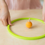 Gelber Regenbogen Kreisel von Grimm's in konzentrischem Ring