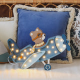 Kinderlampe Vintage Flugzeug von Little Lights in Demin Blue vor Kissen