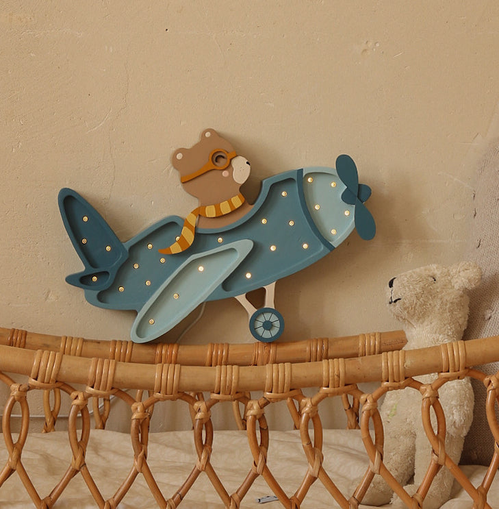 Kinderlampe Vintage Flugzeug von Little Lights in Demin Blue auf Babybett