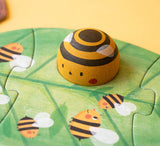 Londji Puzzle BZZZ – Bienenfigur aus Holz auf dem grünen Blätterpuzzle