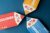 Londji Puzzle My Colours – drei stiftförmige Verpackungen in Rot, Gelb und Blau