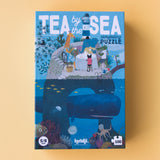 Puzzle "Tea by the sea" von Fjoldi vor gelbem Hintergrund