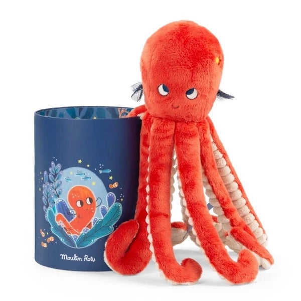 Plüschtier Oktopus Paulie von Moulin Roty neben dekorativer Dose