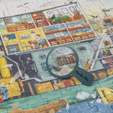 Detailansicht von Puzzle Boot mit 200 Teilen von Moulin Roty mit Lupe für Suchaufgaben