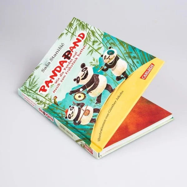 Vorlesebuch "Panda-Pand. Wie die Pandas mal Musik zum Frühstück hatten" von Saša Stanišić und Günther Jakobs_Carlsen Verlag_aufgeklapptes Buch